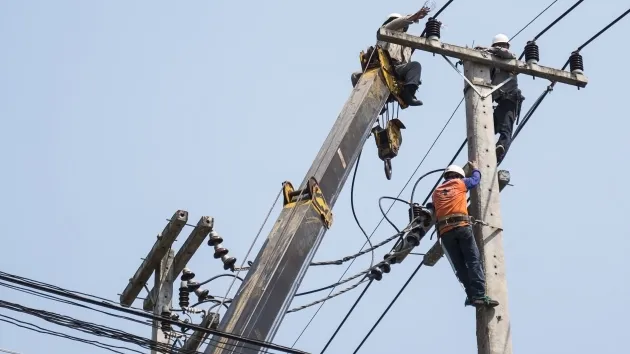 selective-focus-electricians-are-fixing-power-transmission-line-electricity-pole