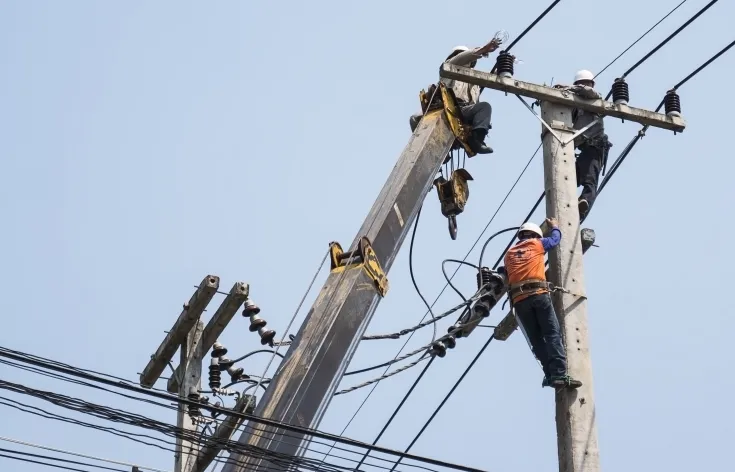 selective-focus-electricians-are-fixing-power-transmission-line-electricity-pole