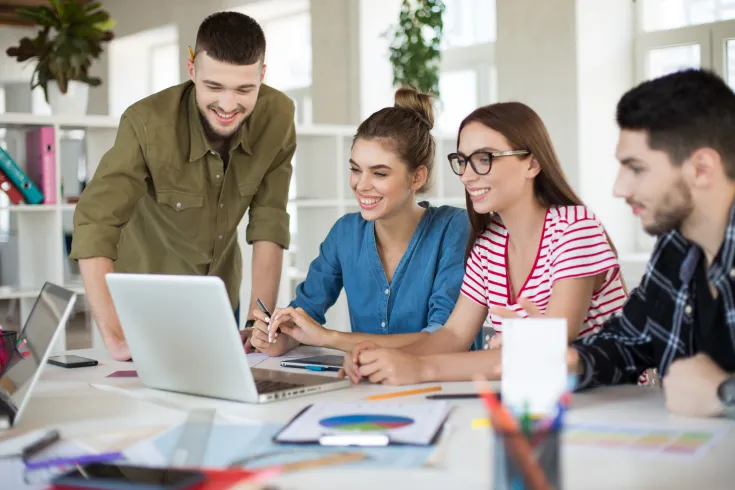 young-positive-business-people-joyfully-working-laptop-together-group-smiling-men-women-spending-time-work-modern-cozy-office young-positive-business-people-joyfully-working-laptop-together-group-smiling-men-women-spending-time-work-modern-cozy-office
