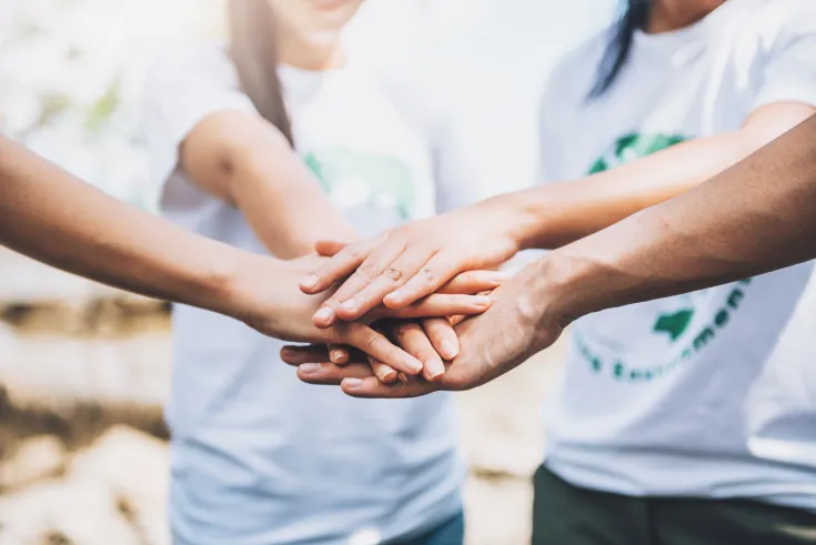 close-up-people-volunteer-teamwork-putting-finger-star-shapehands